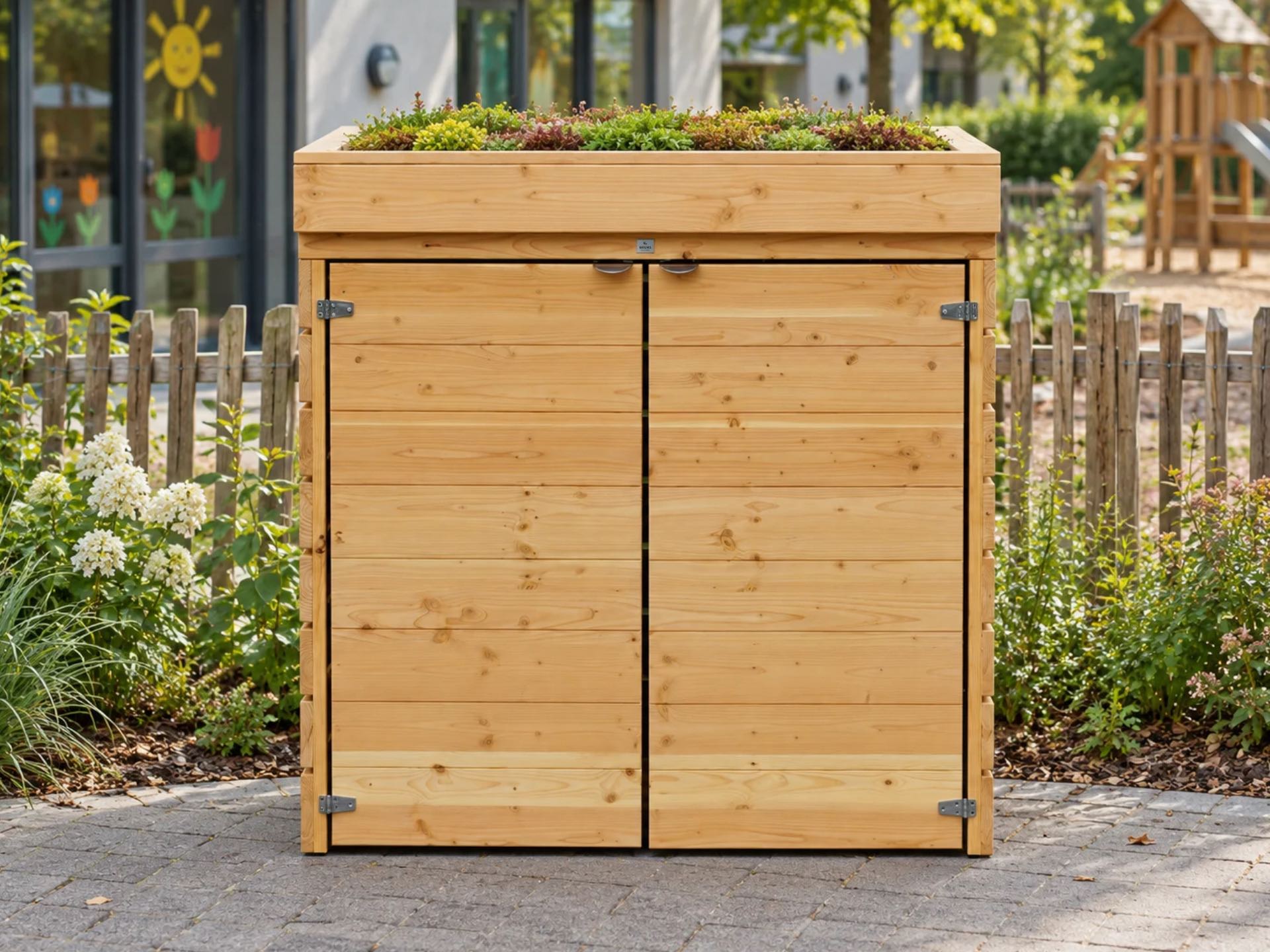 Kinderwagenbox mit Gründach für 2 Kinderwagen oder mehrere Buggys in Kitas und öffentlichen Außenbereichen.